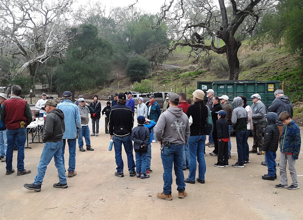 Volunteers during pre-work safety tailboard and work assignment.